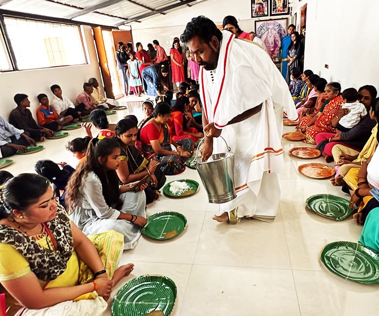 Guruji Serving Devotees