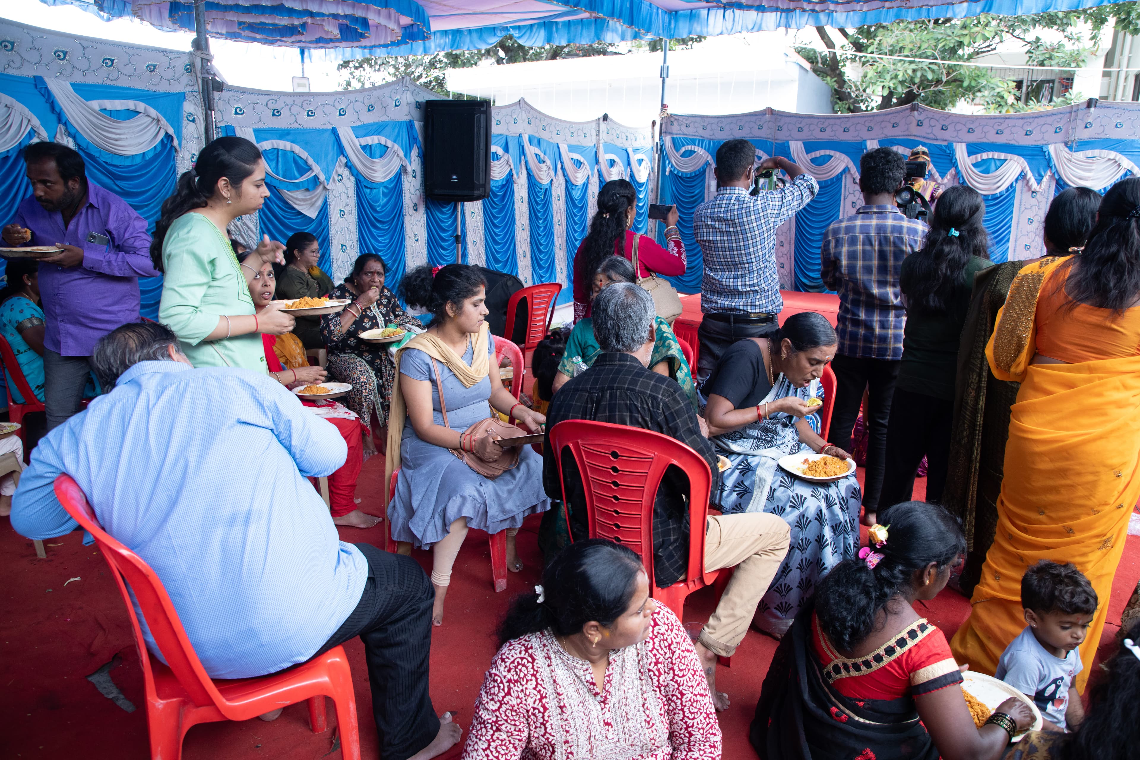 Devotees being served Maha Annadhana prasadam at the temple
