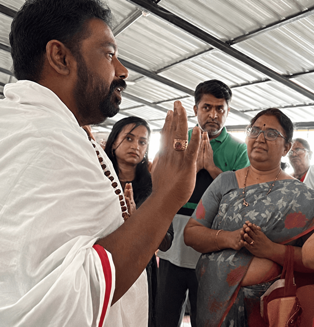 Hands caring for an elder at Sai Aasare